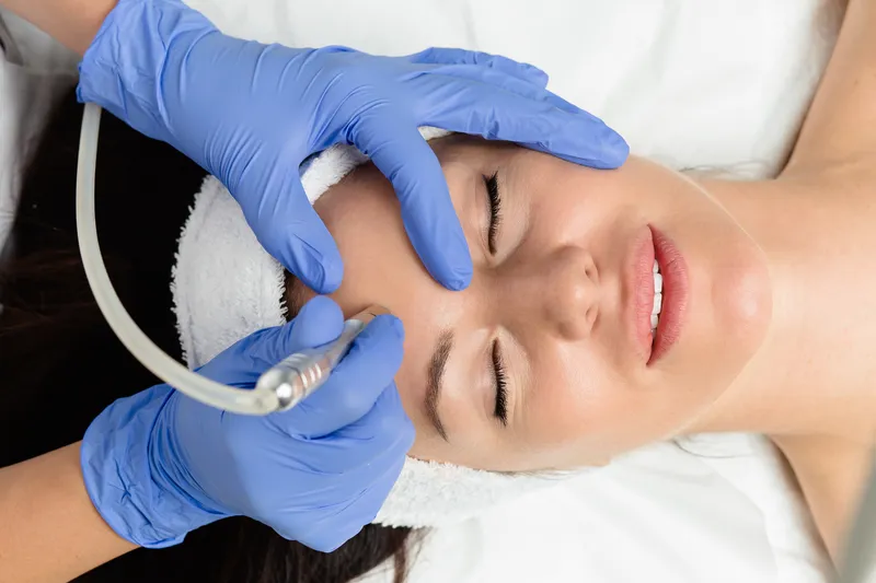 Microdermabrasion resurfacing treatment refining skin texture
